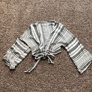 Dark grey and white striped bathing suit top coverup.